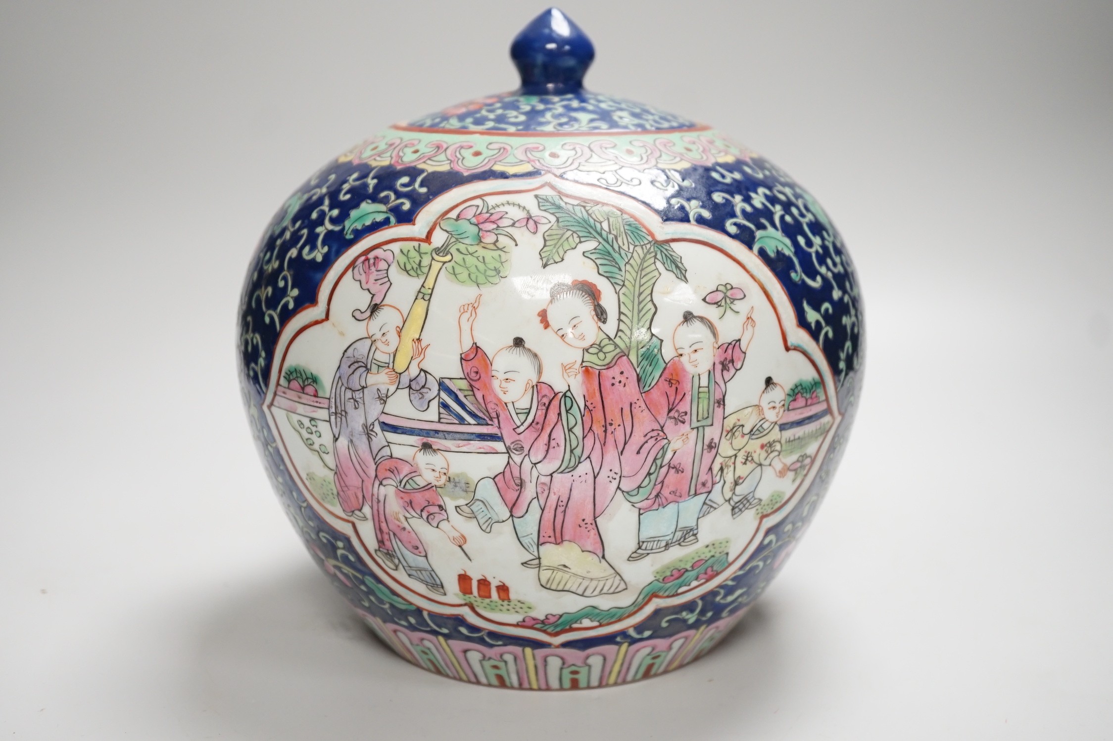 A Chinese famille rose jar and cover, 20cm high